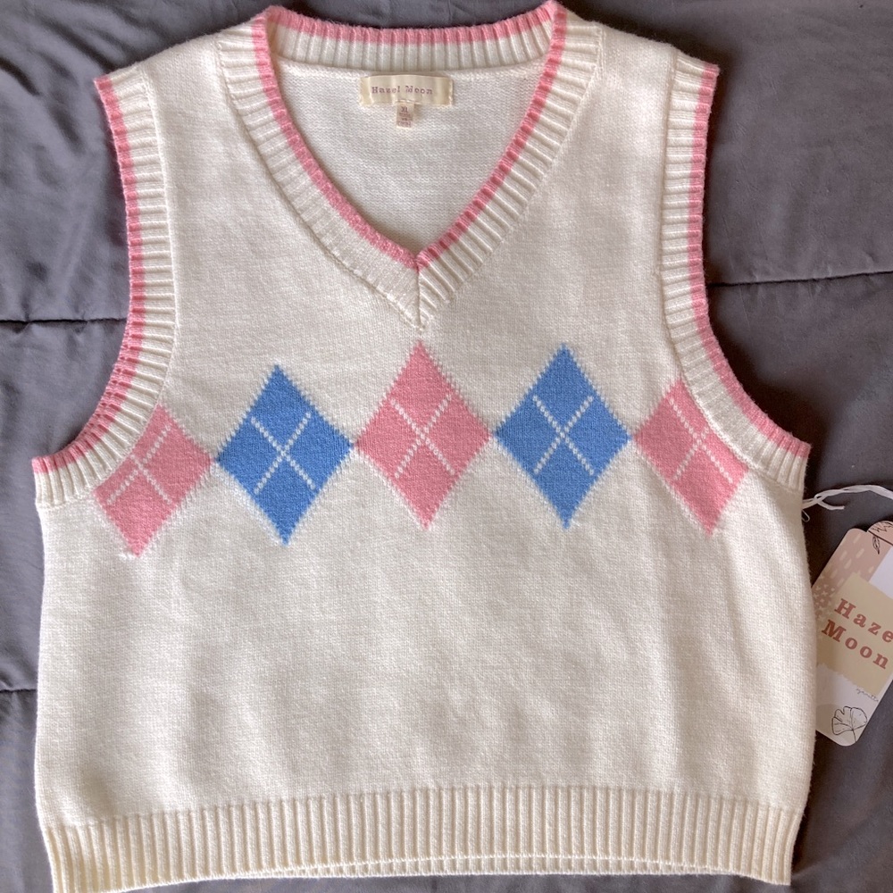 White sweater vest with Argyle pattern on the front